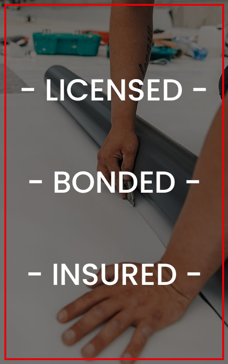 Worker cutting up a TPO sheet with the words 'licensed, bonded, and insured' over the image